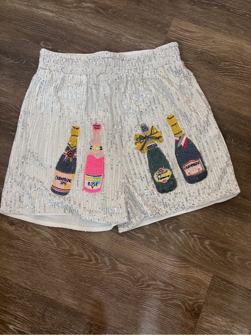 Women’s Sequin Embellished Silver Party Shorts with Champagne Bottles.